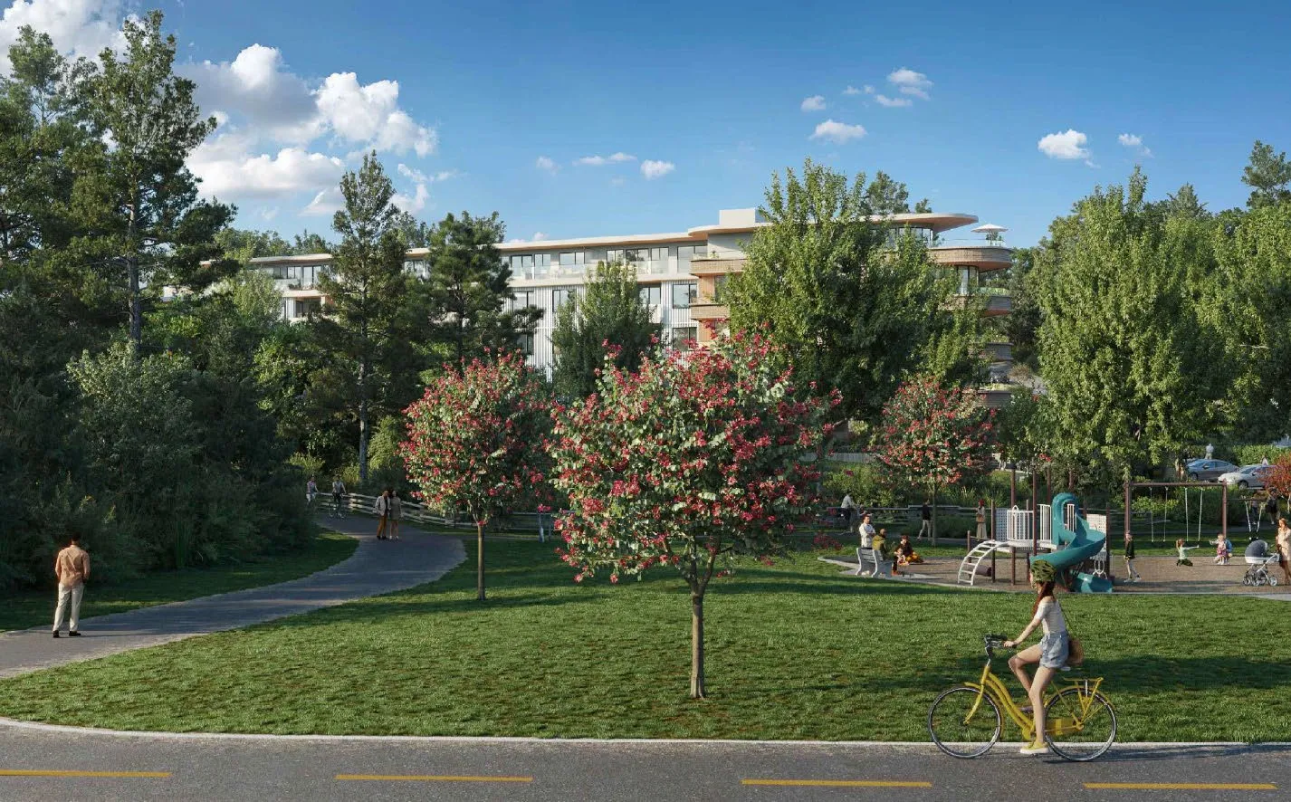 Figure 4 View from E & N Trail rendering showing the building situated behind trees and a park area with a playground and cyclist