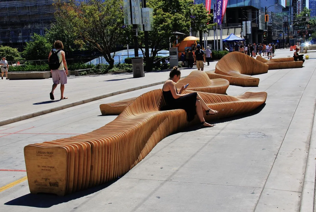 S-shaped long wooden bench in a public square