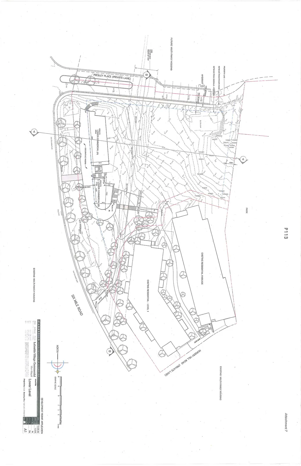 Site plan drawing for the Lakeside Village Commercial project, showing the layout of the lower level. The plan includes two proposed commercial buildings, existing residential structures, a parkade, and infrastructure details like roads, setbacks, and hydrants.