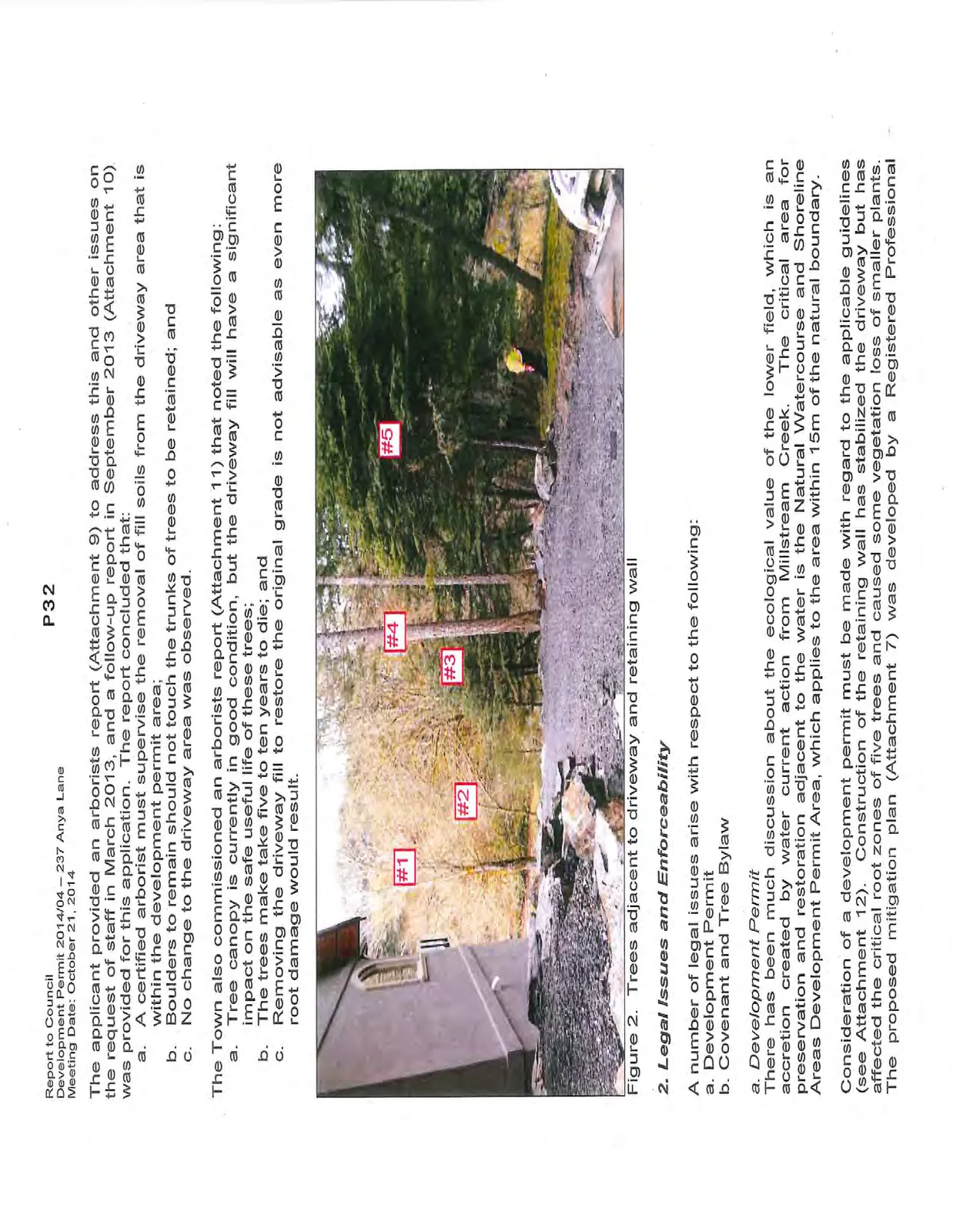Figure 2. Photo showing numbered trees #1 through #5 adjacent to the driveway and the stacked boulder retaining wall