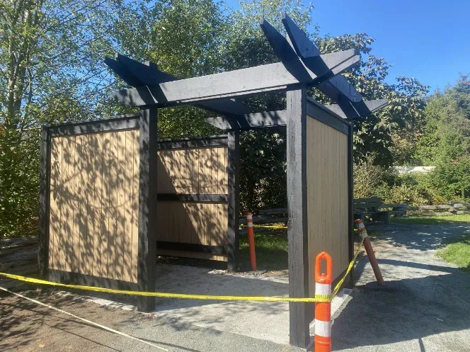 Portable toilet enclosure at Portage Park