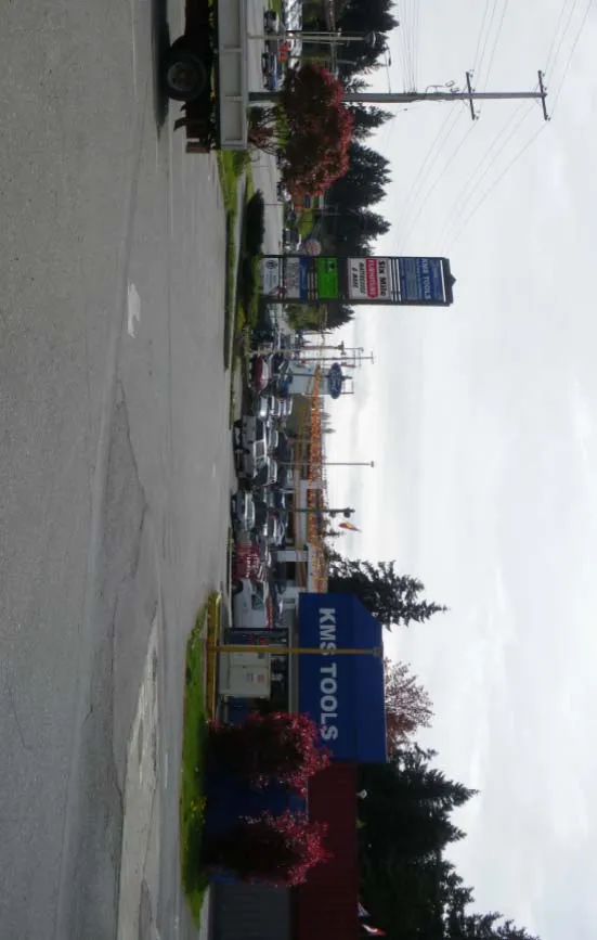 Contextual Street View #4 - View of parking lot and KMS Tools sign