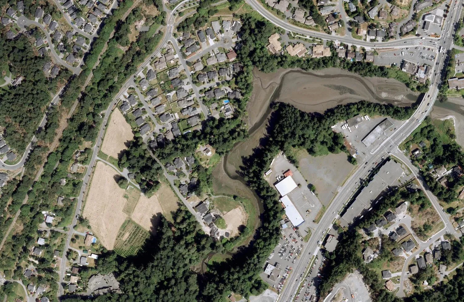 Aerial view of the subject property and surrounding landscape showing Millstream Creek.