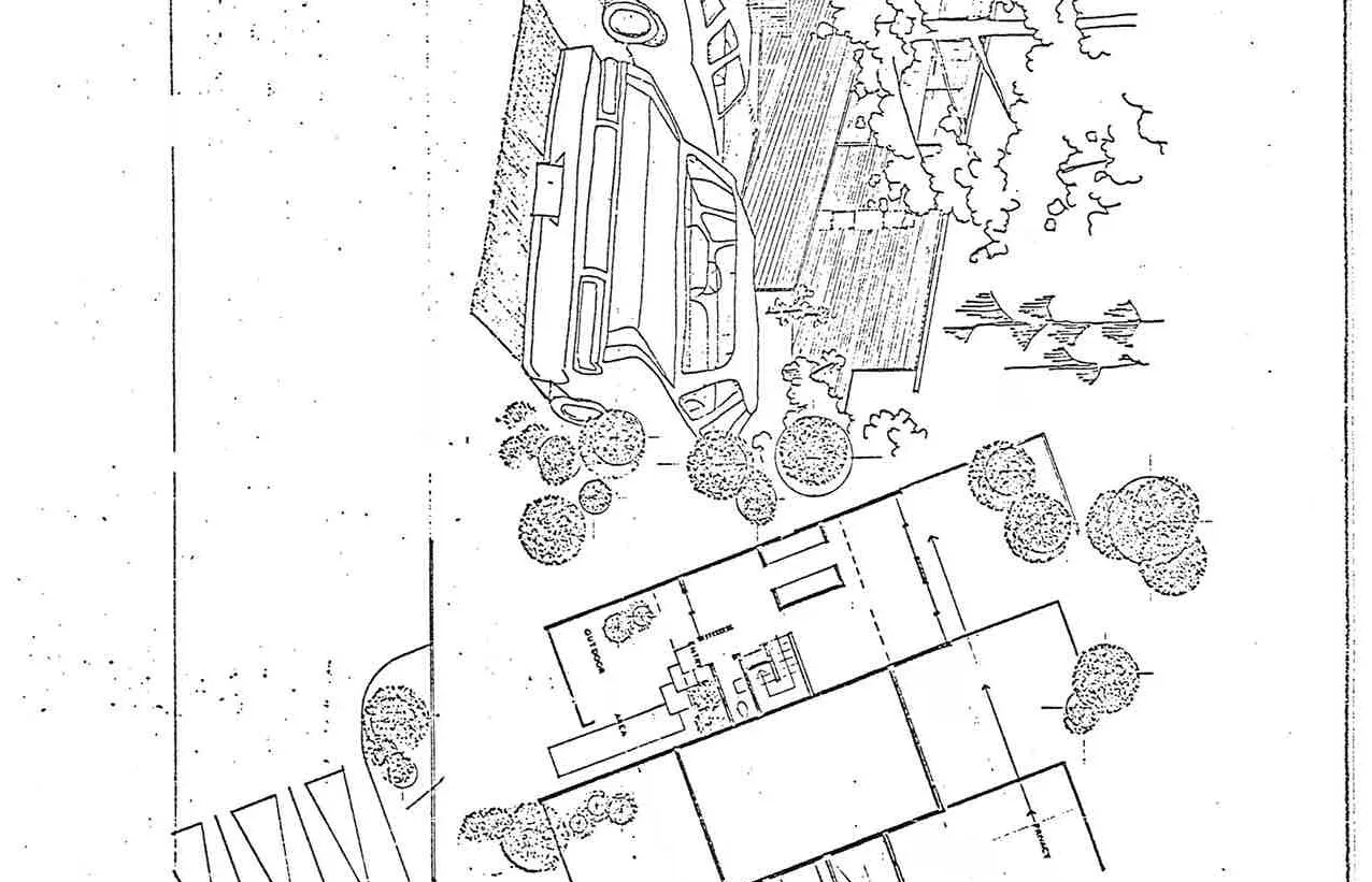 Architectural perspective rendering showing the driveway and two parked vehicles in front of the unit