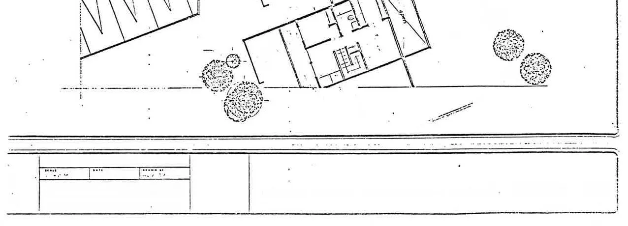 Floor plan diagram of a typical townhouse unit showing the kitchen, dining, living, and outdoor living areas