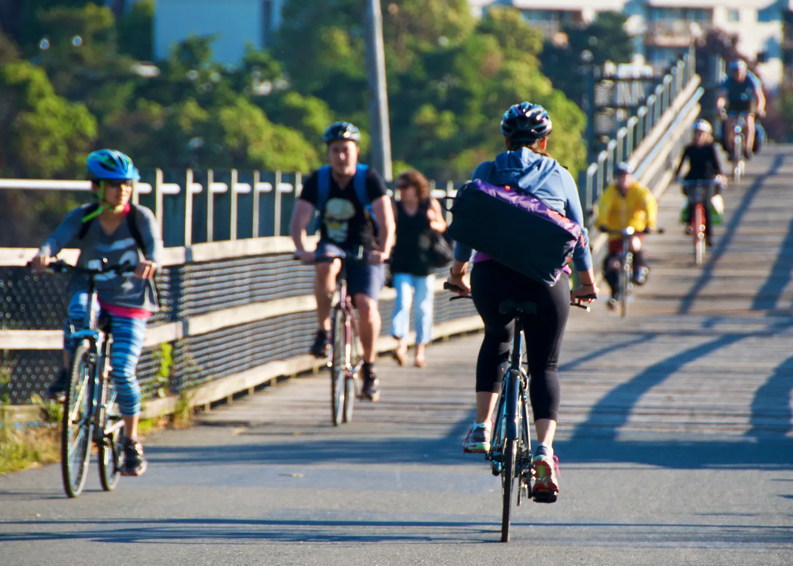 Illustration of three people on bicycles