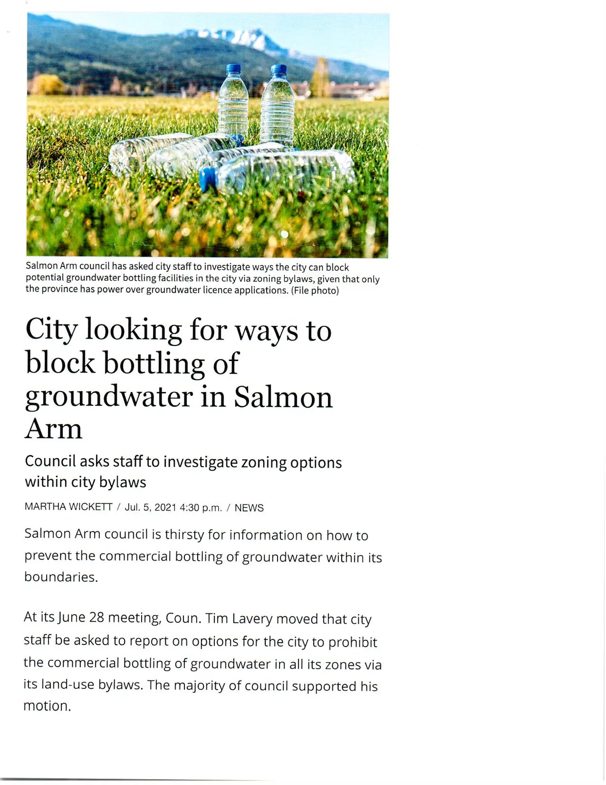 Plastic water bottles lying on green grass with a blurred background of mountains and trees. Caption: Salmon Arm council has asked city staff to investigate ways the city can block potential groundwater bottling facilities in the city via zoning bylaws, given that only the province has power over groundwater licence applications. (File photo)