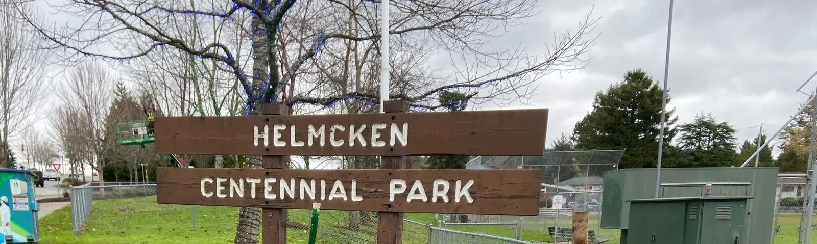 Wooden sign for Helmcken Centennial Park