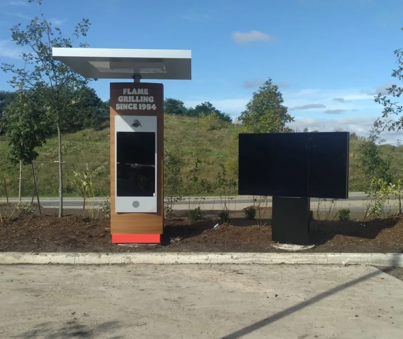 Example photograph of a newly installed electronic drive-thru sign structure before activation