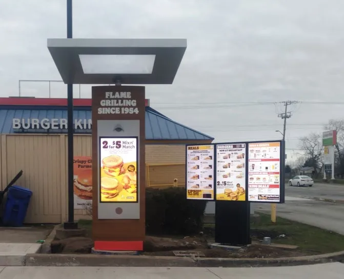 Example photograph of a newly installed and powered electronic drive-thru sign showing menu content