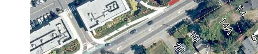 Aerial map showing a section of Helmcken Road with residential properties and the start of a red line indicating new curb and sidewalk work