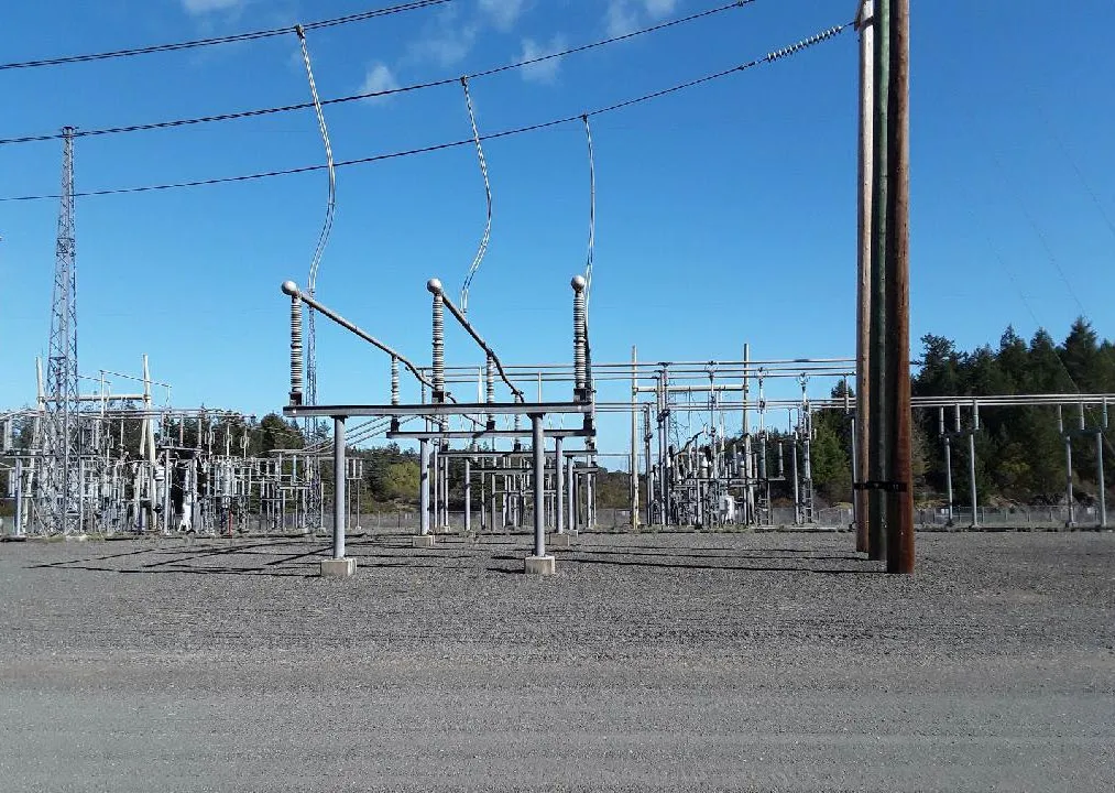 Electrical substation with various transmission towers and lines