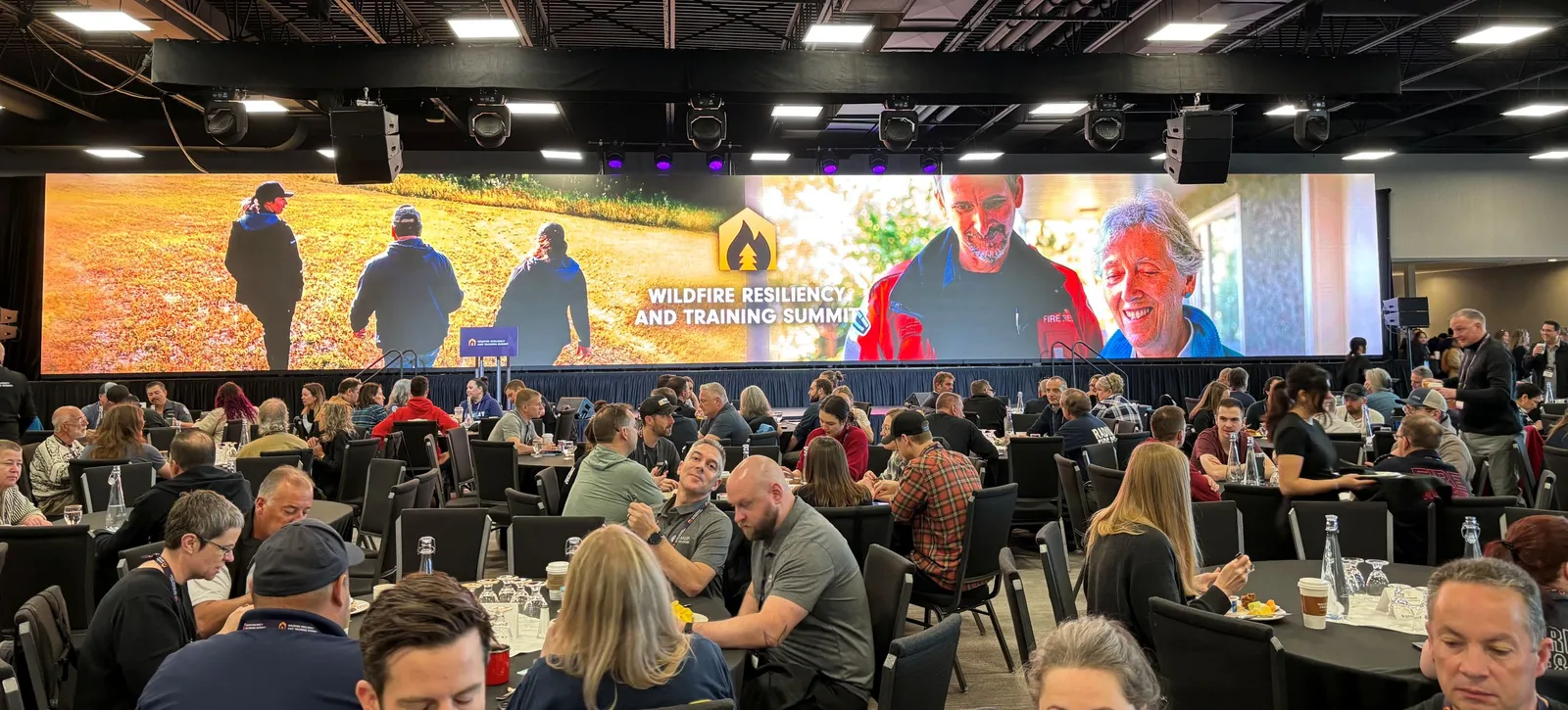 Large gathering of attendees at a Wildfire Resiliency and Training Summit session