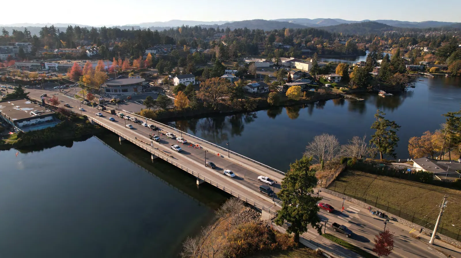 Aerial view of a bridge and town overlooking a body of water