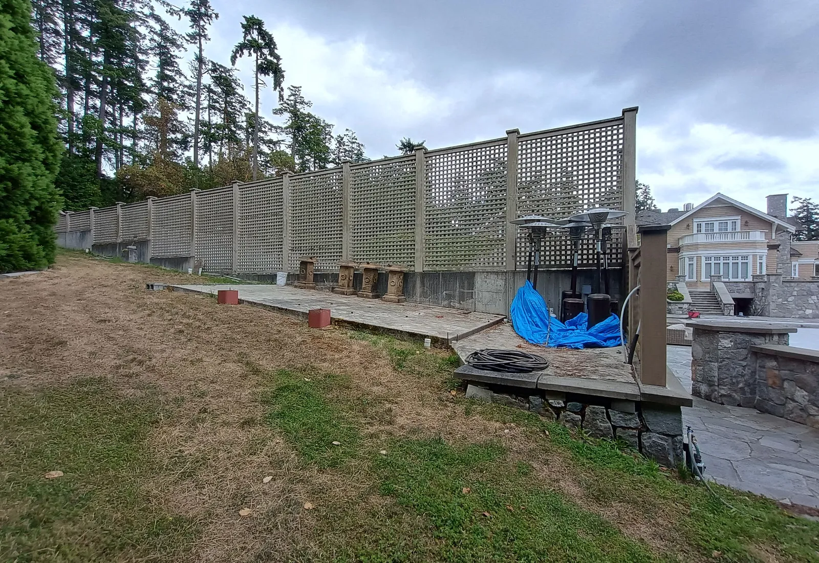 Photo of the existing concrete pad beside the tennis court at 157 View Royal Avenue