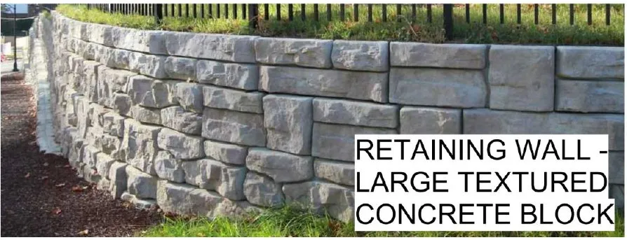 Close-up of a large textured concrete block retaining wall