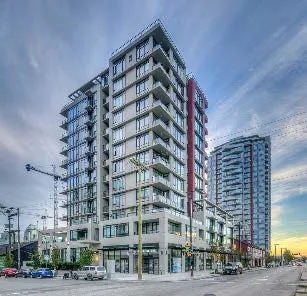 Modern high-rise mixed-use building with glass facade