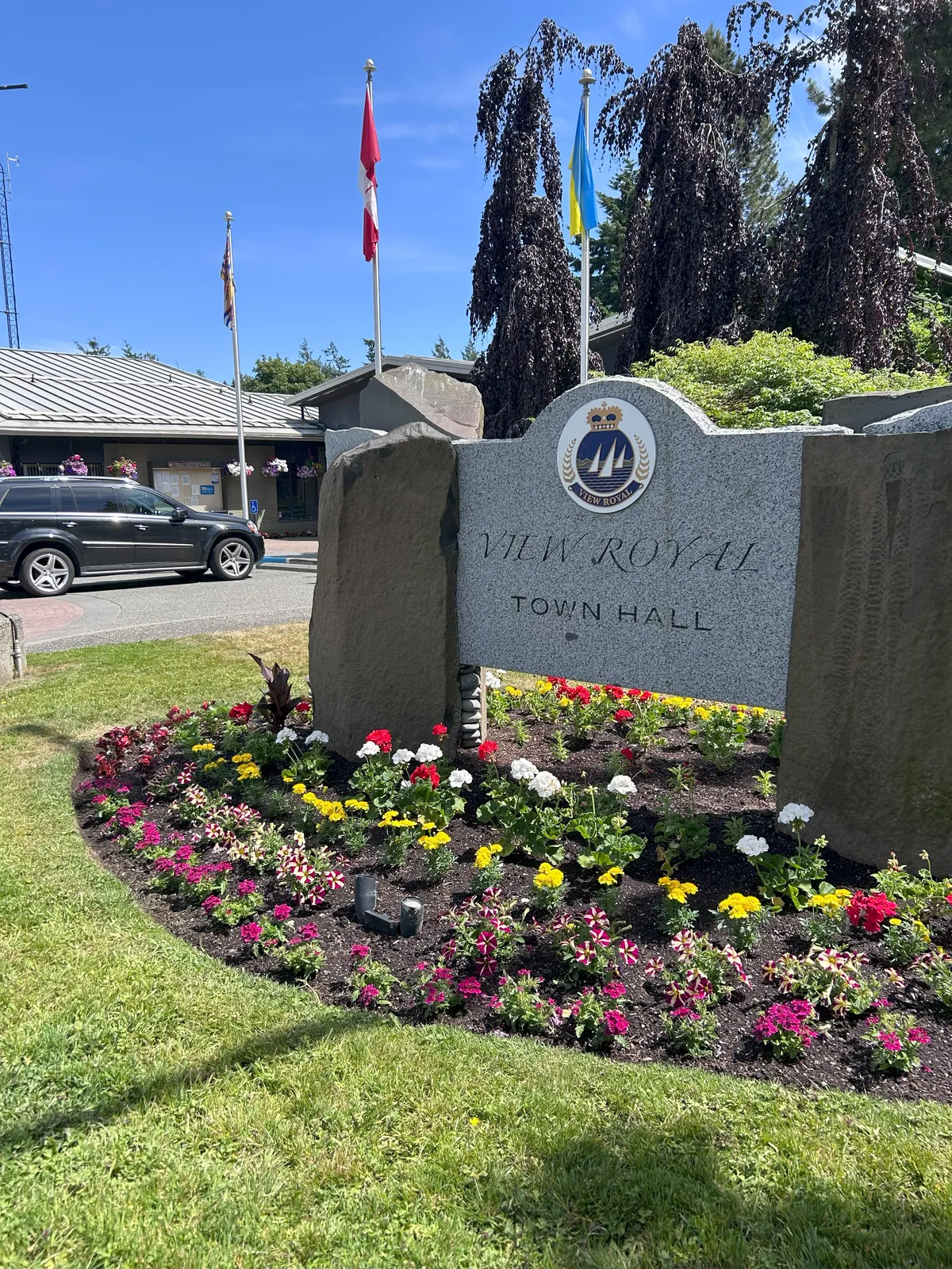 Freshly planted flowers at Town Hall Sign