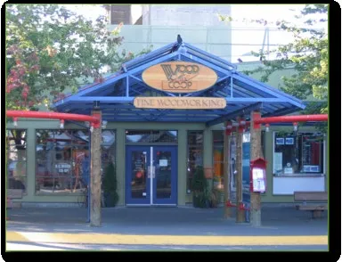 Commercial building entrance with blue awning and "WOOD CO-OP" signage