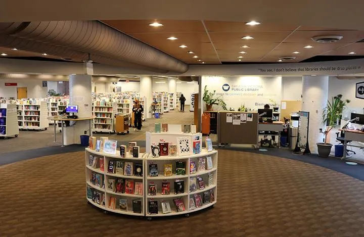 Interior view of the Central Branch library showing public computer stations and patrons.
