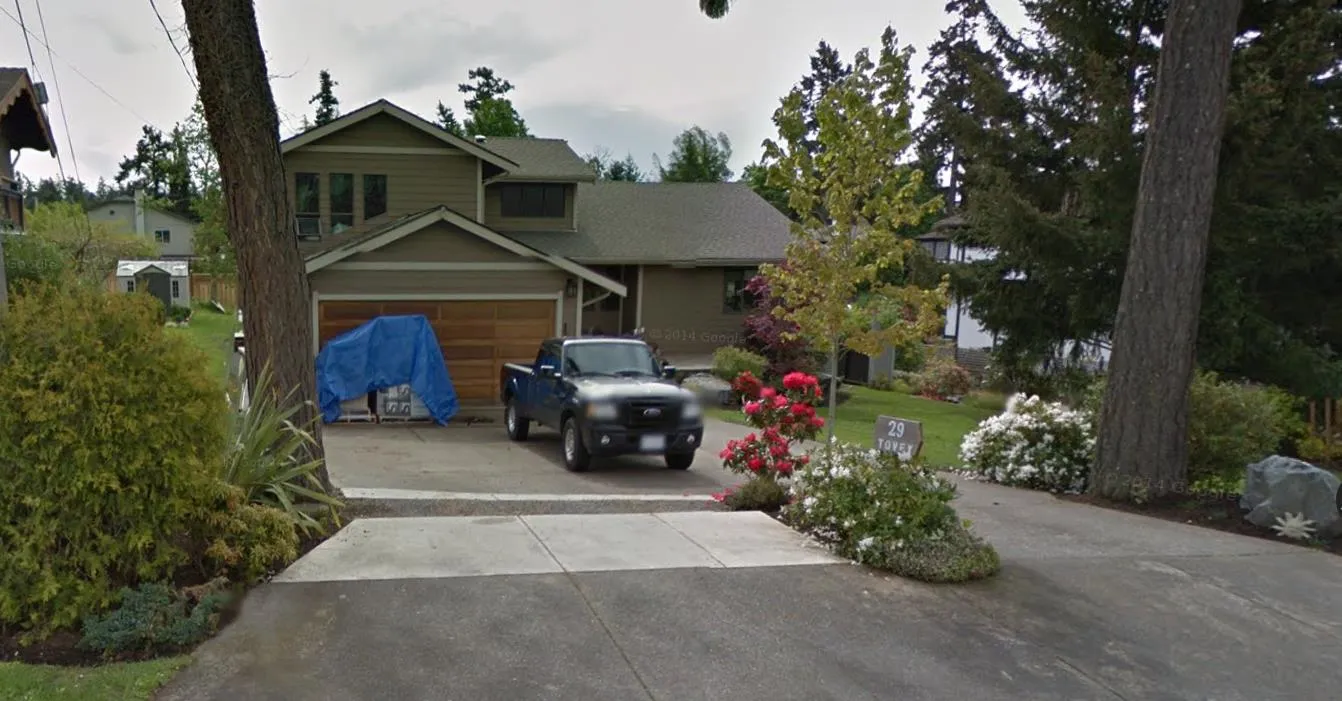 Google street view from May 2014 showing driveway after concrete was cut and replaced with gravel