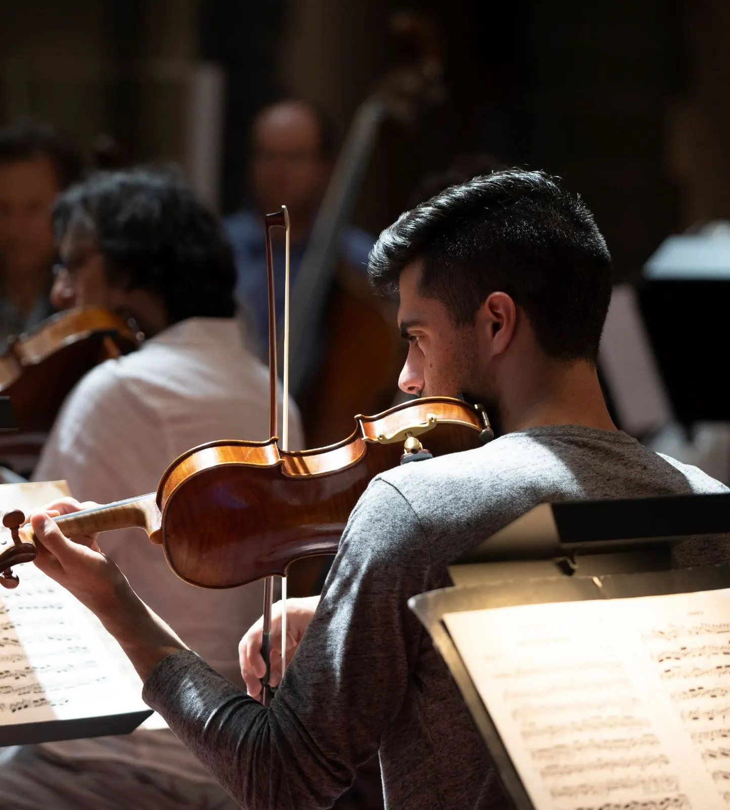 Victoria Symphony Rehearsal 2021 showing a violinist