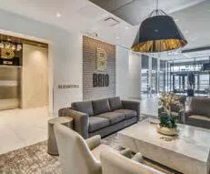 Modern kitchen interior with a large central island and dark grey cabinetry