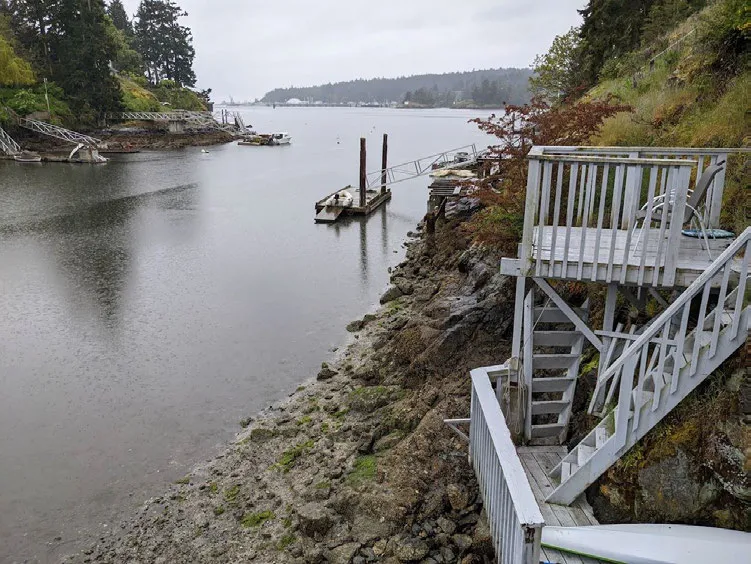 Photo 2. View of upper stairs at Project Site and rocky bluff within Limekiln Cove (facing south).