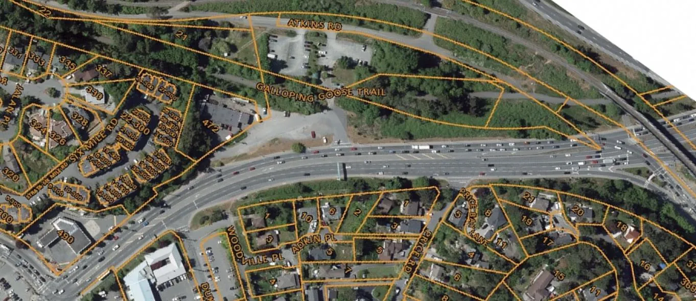 Aerial satellite view of the current area layout with property lines and road labels