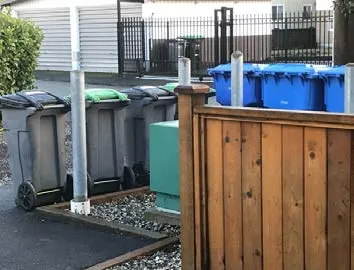 Locate and screen garbage and recycling areas
