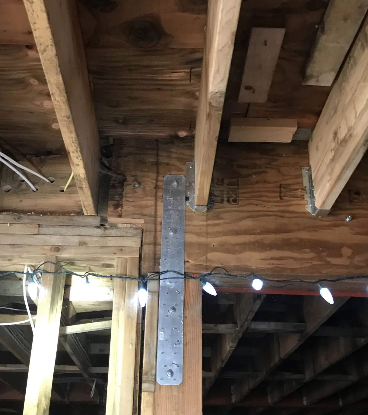 Photo of house exterior under construction showing sheathing and rainscreen on June 19, 2023