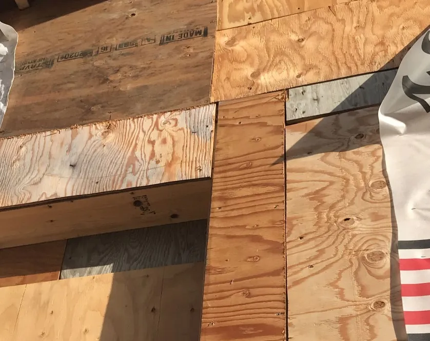 Close-up photo of wall framing showing the junction with a floor or foundation