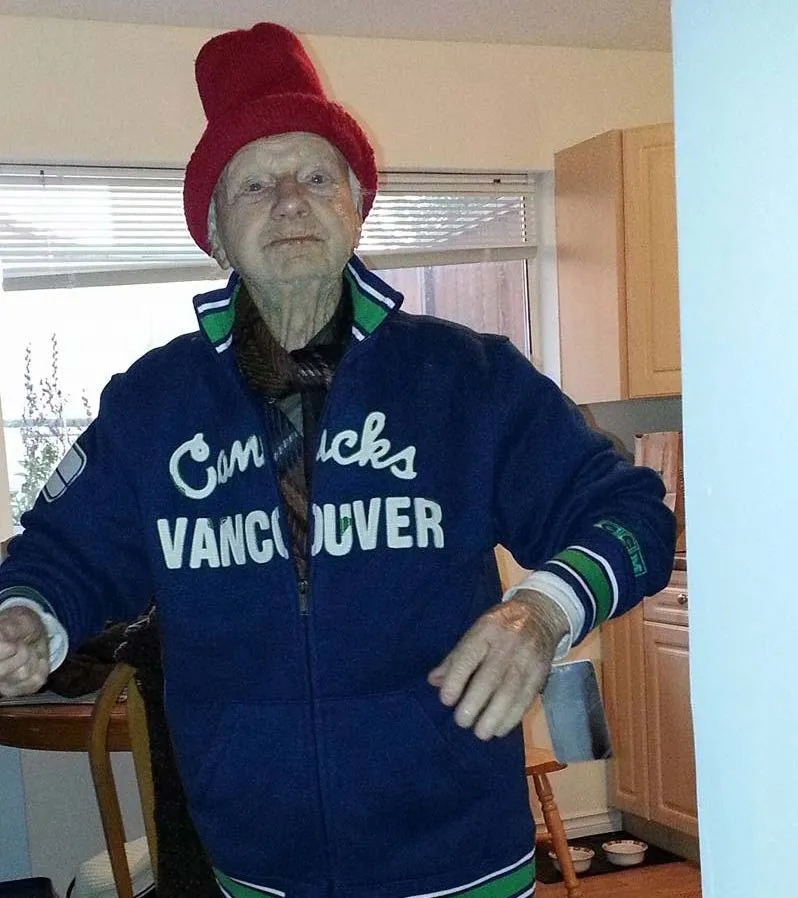Photograph of Jack Cosier wearing a red hat and a Vancouver Canucks jacket