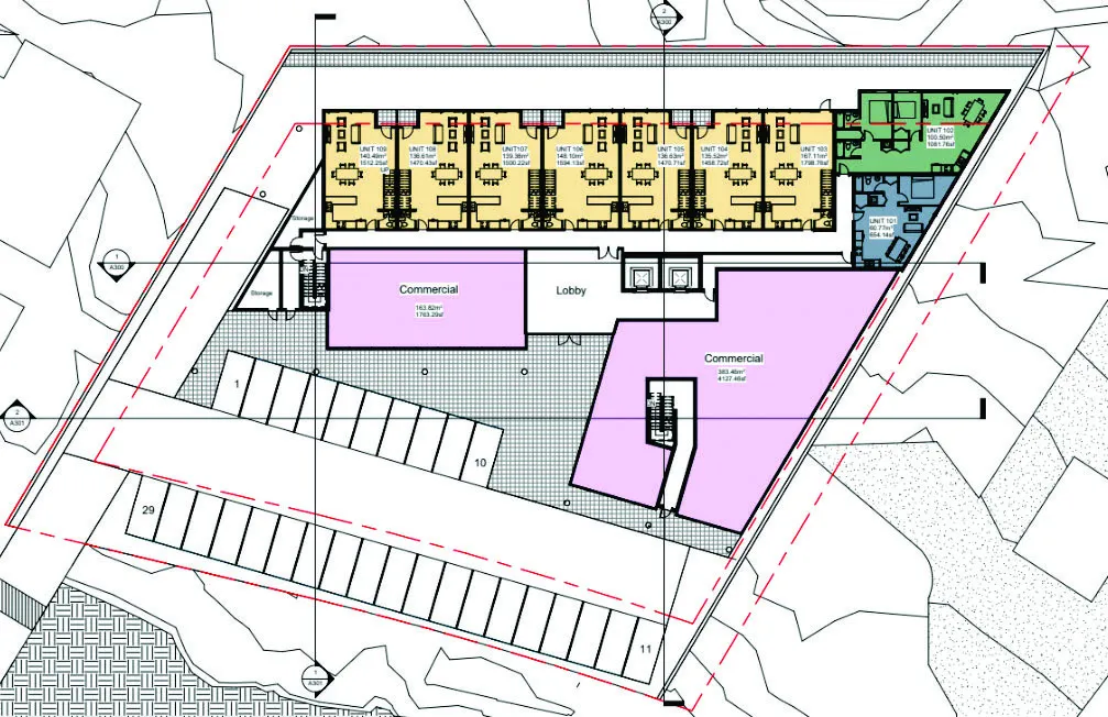 Ground level site plan showing commercial spaces, lobby, and surface parking layout