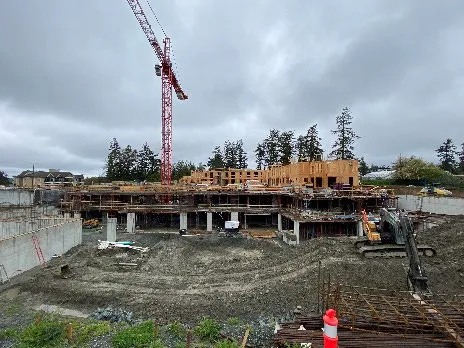 Construction site photo with crane at 1449 Burnside Rd W