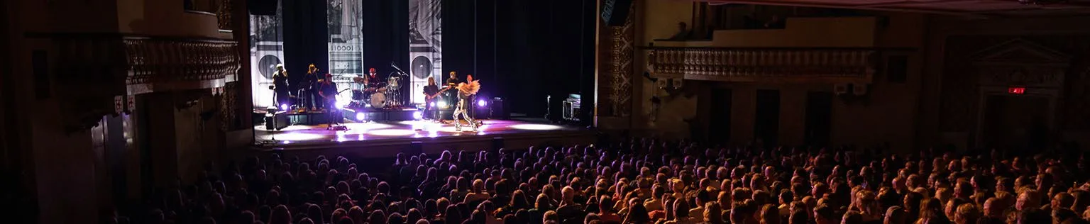 Amanda Marshal at the Royal Theatre, July 2023, showing the performers on stage from the back of a large audience