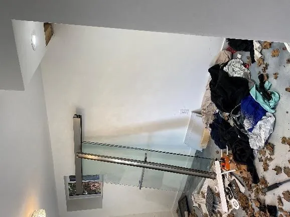 Debris and glass door in entrance room