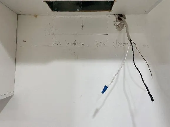 Disconnected wiring and venting in kitchen