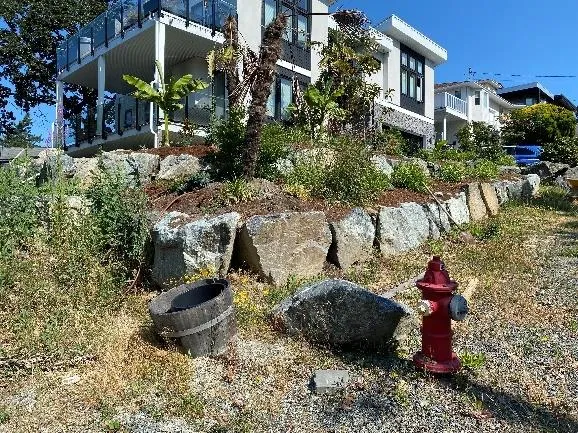 Rock retaining wall at 21 Eaton next to a fire hydrant