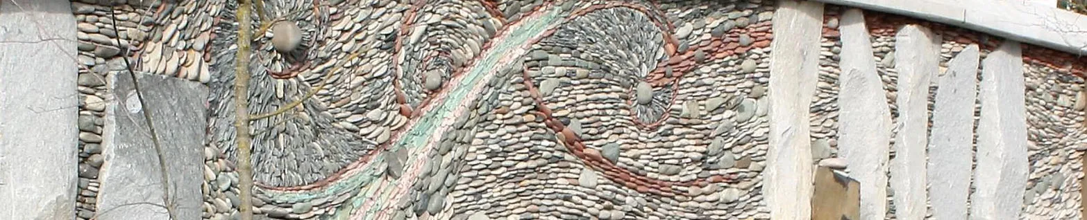 Detail of river rock mosaic on the stone wall