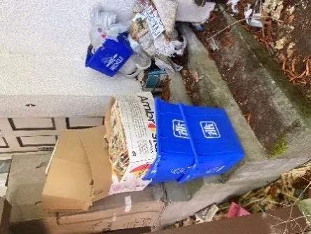 Stairwell covered with miscellaneous rubbish and trash