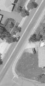 Aerial view of a road adjacent to a residential property