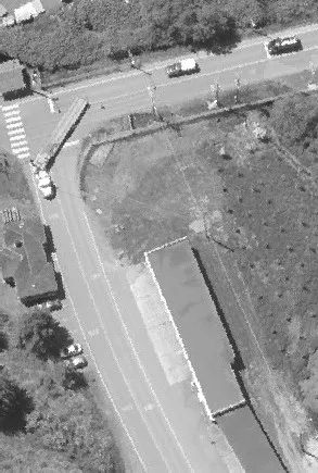 Aerial view of a parking lot near several large buildings
