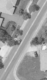 Aerial view of Island Highway passing through a commercial zone