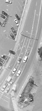Aerial view of residential houses near a roadway