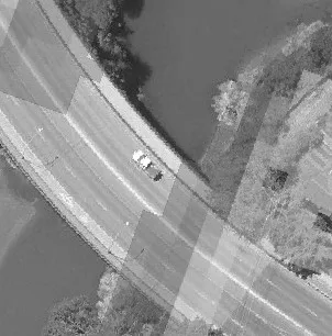 Aerial view of Island Highway with vehicles and adjacent parking lot