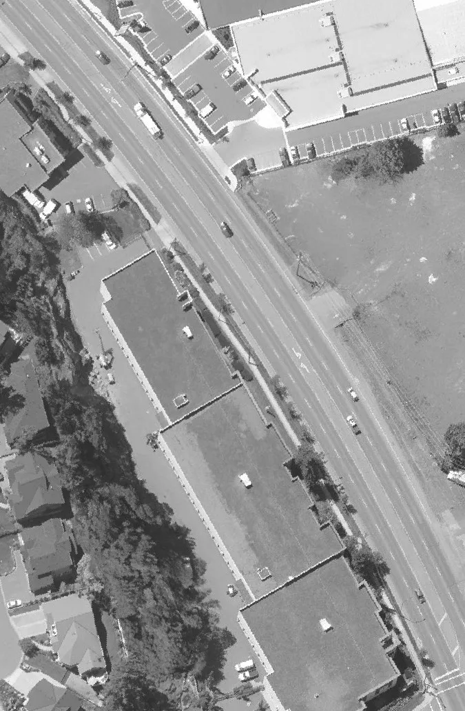 Aerial view of a parking lot with numerous parked vehicles