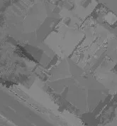Aerial view of residential properties in a wooded setting