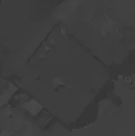Aerial view of a parking lot near several large buildings