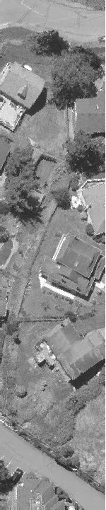 Aerial view of a parking lot area adjacent to a roadway